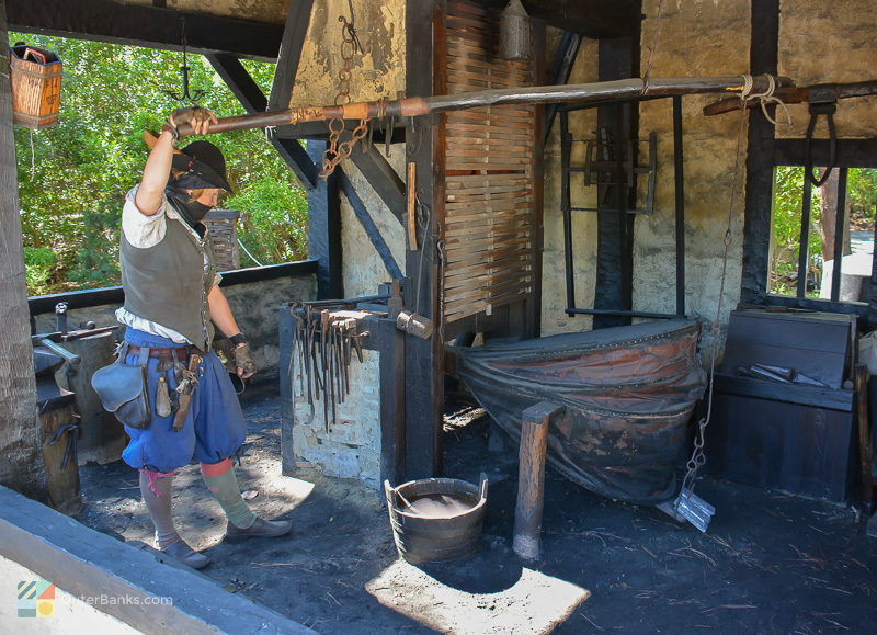 An interpreter uses original methods to create iron tools and nails at Roanoke Island Festival Park
