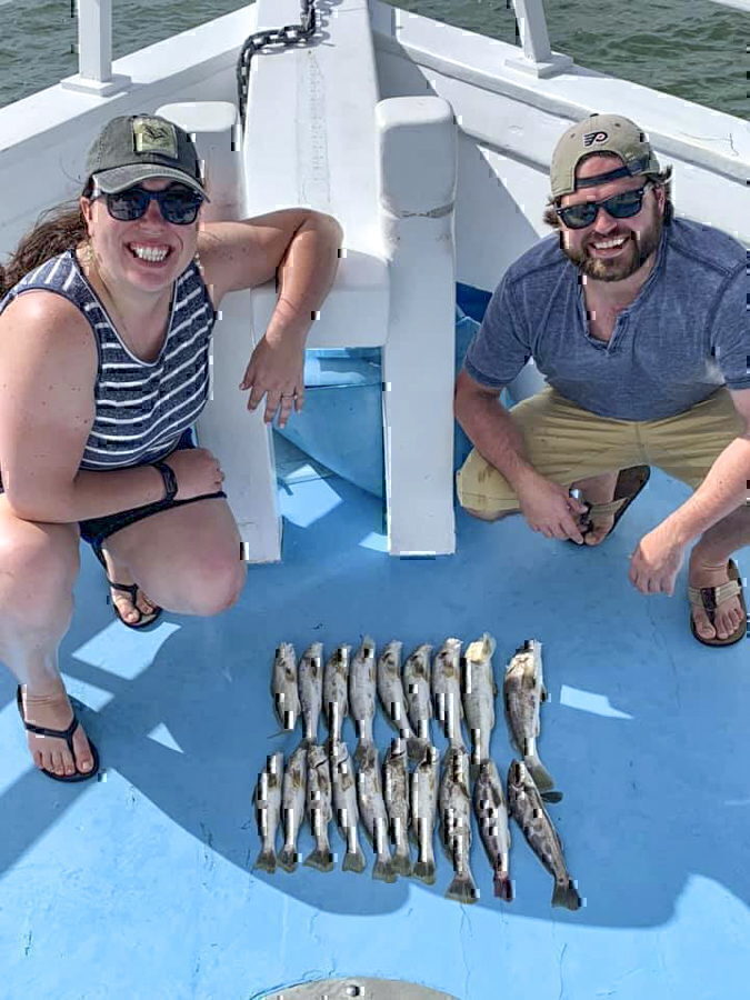 A couple poses with their catch from Miss Oregon Inlet